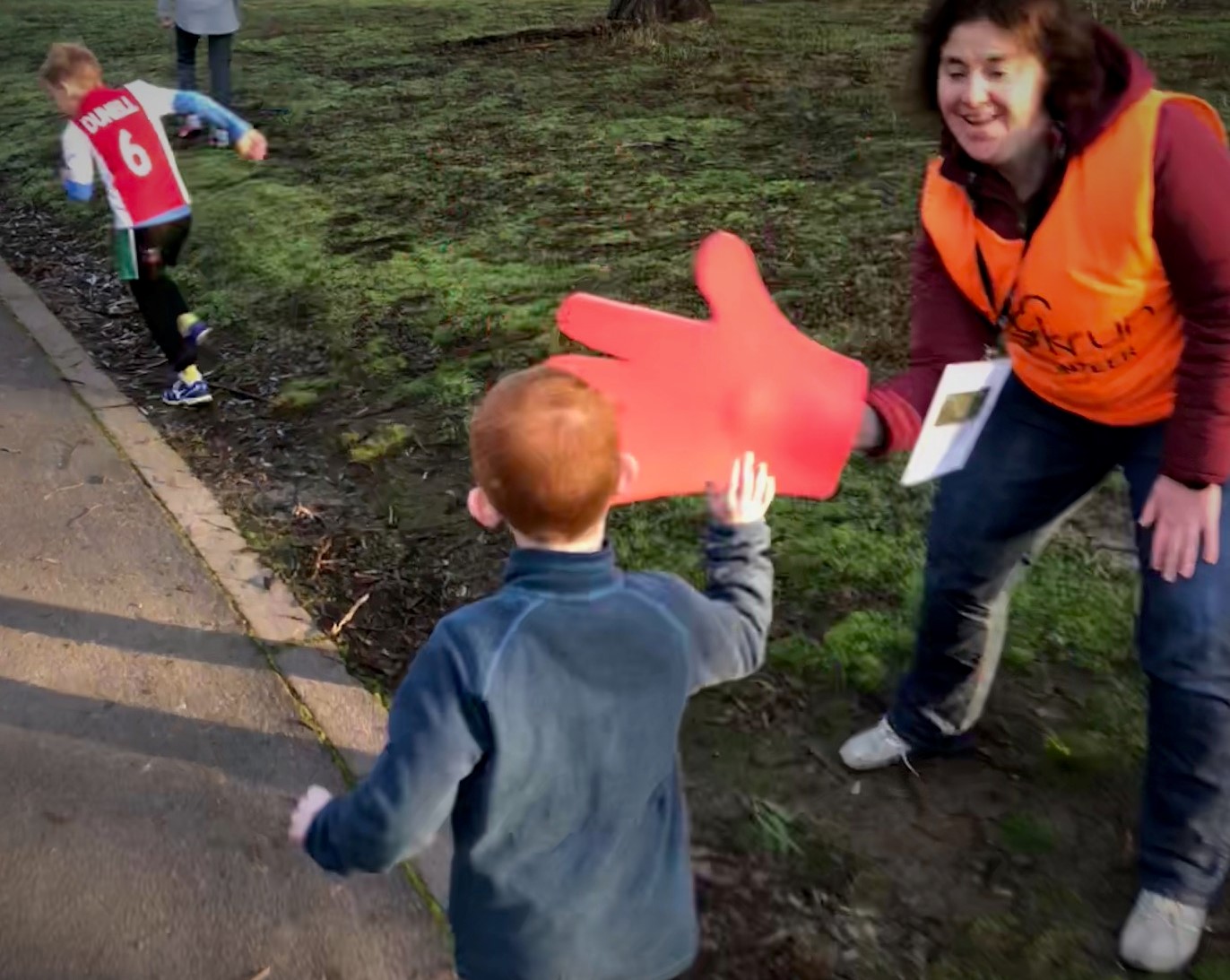 Our 6 year old gets a high-5 at Westerfolds Junior parkrun